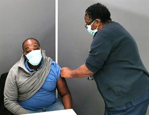 Andre getting a vaccine