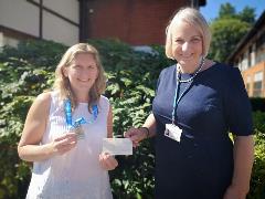 Claire Reece handing over cheque