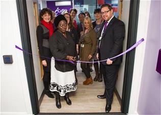 Cutting the ribbon is Dr Comfort Momoh MBE, FGM Consultant and Public Health (left) and Mike Passfield, Head of iCaSH (right