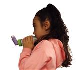 Young girl using an inhaler via a spacer
